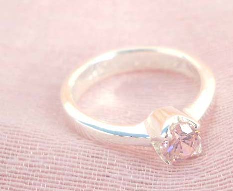 925. stamped silver ring with a round pinky cubic zirconia design