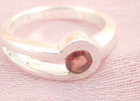 Favorite 925. stamped silver ring motif a clip holding ruby cz design