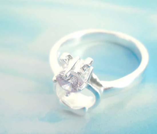 Bow tie gift holding light purple cz,designer inspired 925. sterling silver pendant