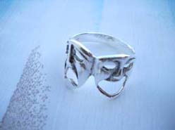 925. stamped silver ring with mask design